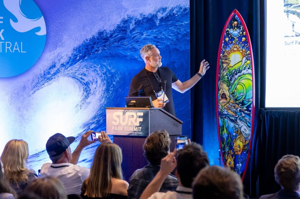 palm valley's Luke Altschwager on stage at Surf Park Summit