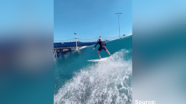 a person surfing in a wave pool
