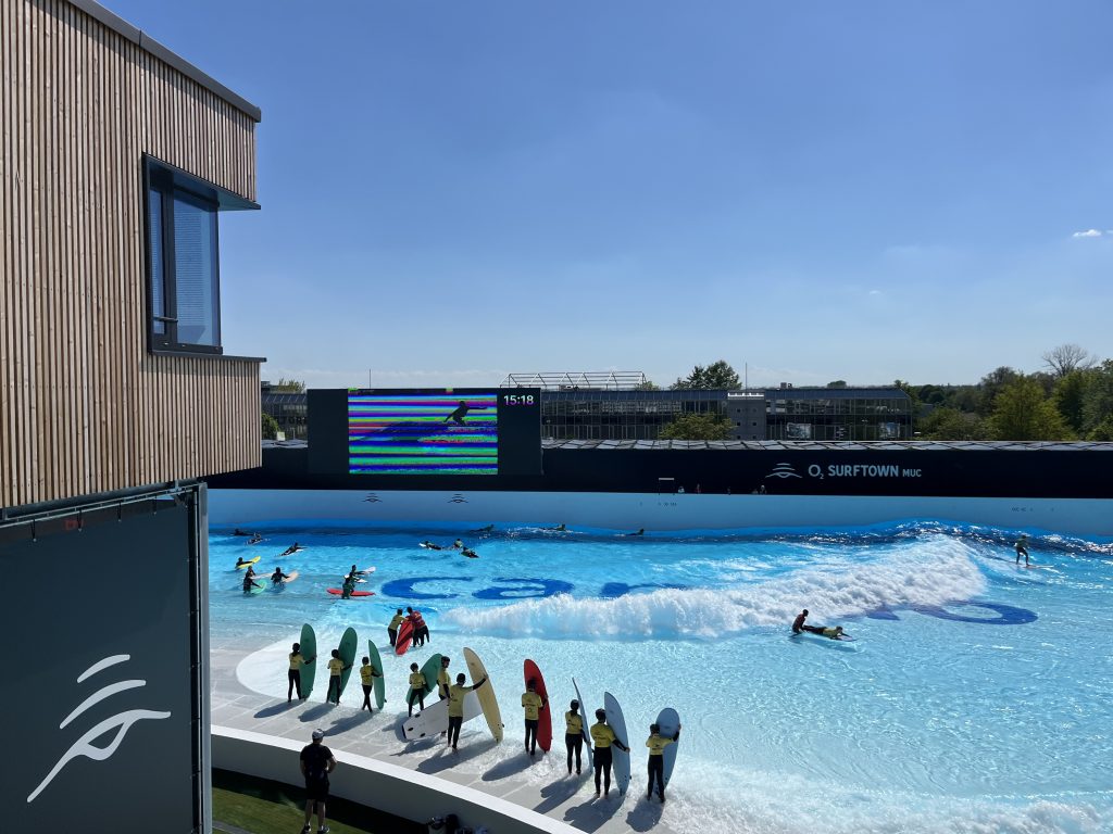 surfers wait in europe to surf at a park