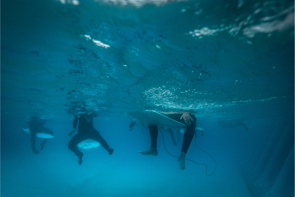 surfers floating in the Wavegarden pool at The Wave