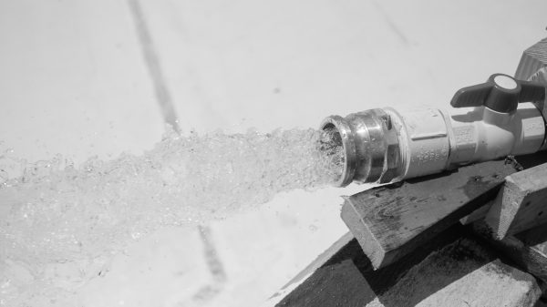 a hose fills the pool at Atlantic Park